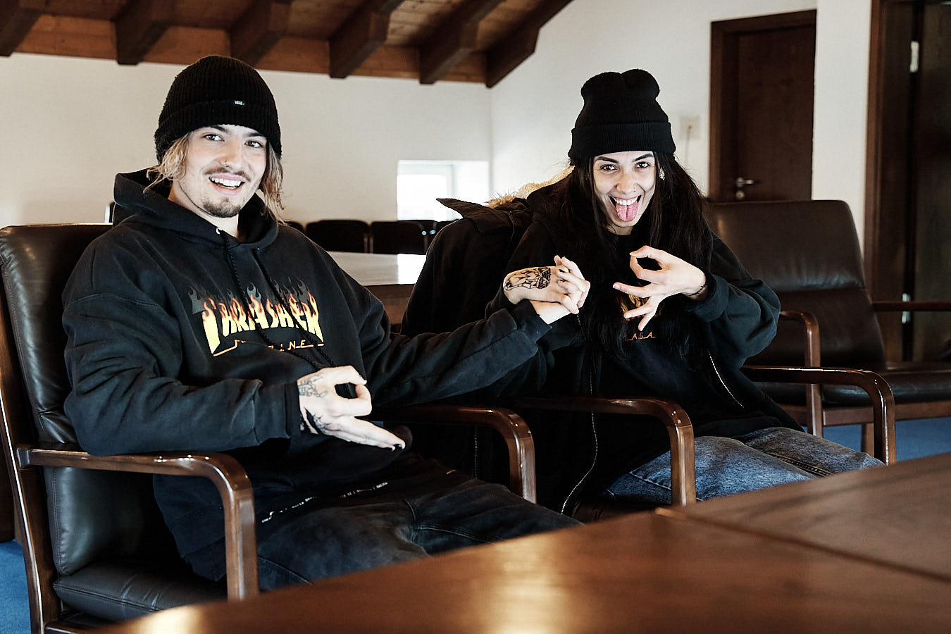 young couple with skateboarding close. both are relaxed and excited. they are just about to get married